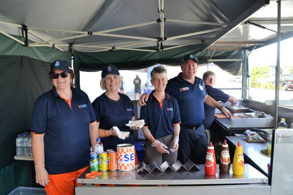 SAUSAGE SIZZLE: SES volunteers Tania Gromer, Sue Jessup, Christine Mann, and Chris Ball serving up some snags at Bunnings North Launceston. Picture: Kasey Wilkins