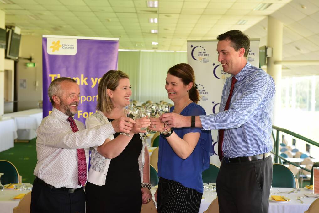CHEERS: Wayne Fenton, Sheila Tivan, Karen Priestly and Phil McCulloch raise their glasses for the Relay for Life launch at the Tasmanian Turf Club. Picture: Paul Scambler.
