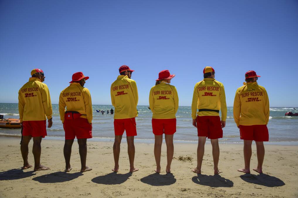 RED AND YELLOW: Lifeguards at the Bridport Surf Life Saving Club keeping watch on the beach. Picture: Paul Scambler