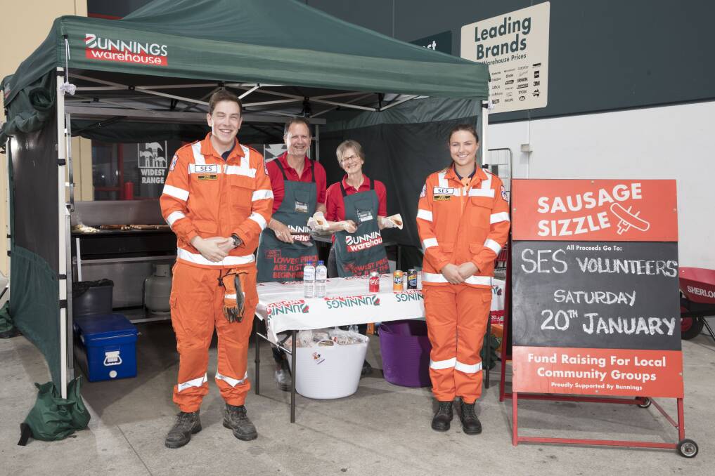 EVERYDAY HEROES: Bunnings Warehouse team members helping out the State Emergency Service volunteers on the barbeque. Picture: supplied