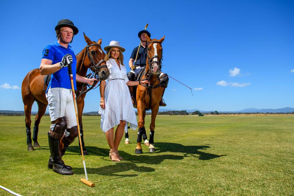 Barnbougle Polo general manager Penelope Sattler stands between professional polo players Tommy Martin and Henry William. Picture: Scott Gelston