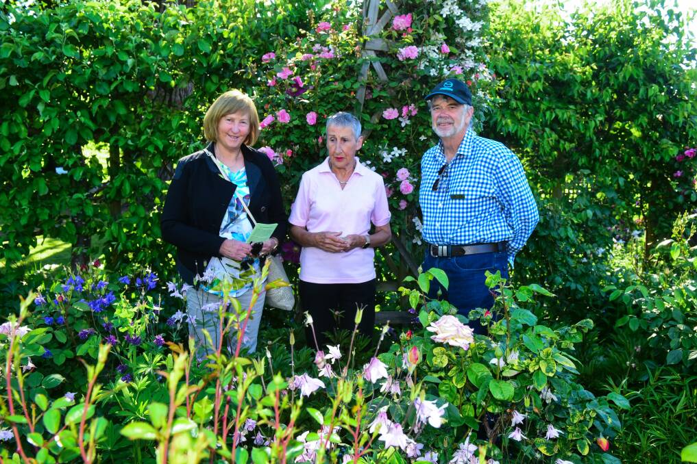 BLOOMING: Bathurst Garden Club members Gillian and Chris Bayliss admiring the gardens with Franklin House Garden Coordinator Gillian Forsyth. Picture: Neil Richardson