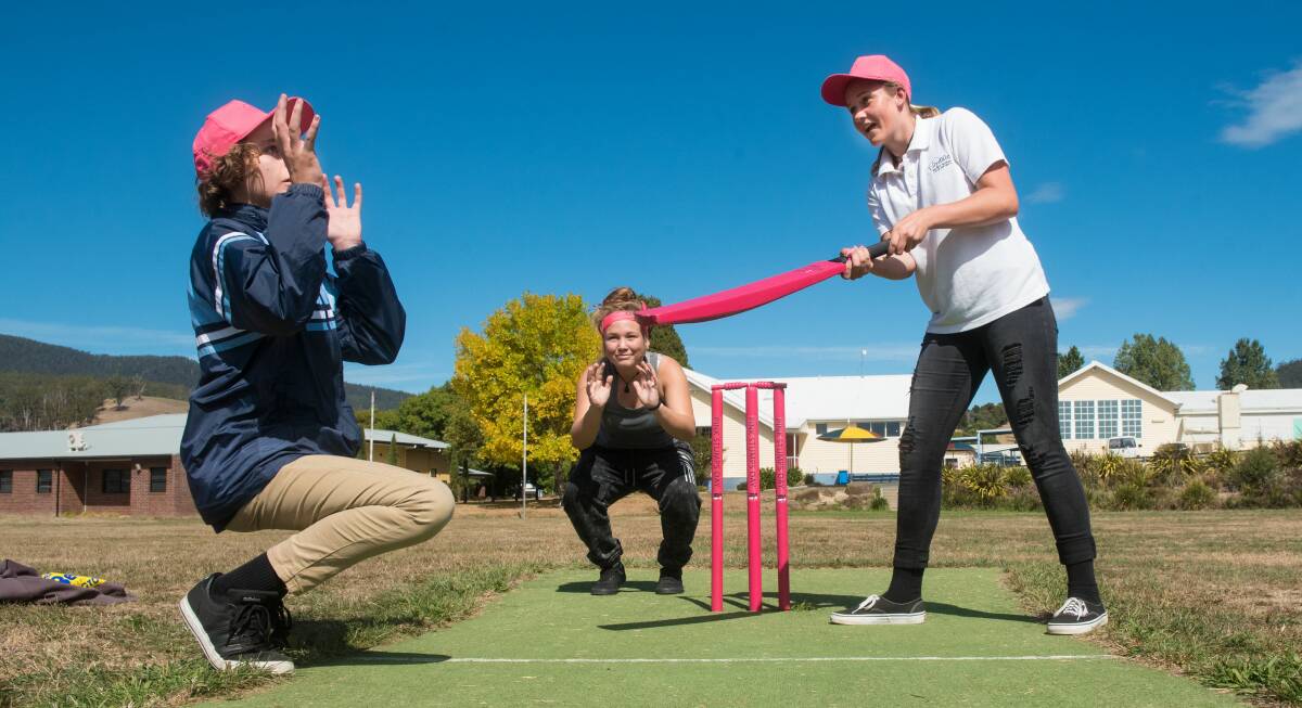 PINK: Lilydale District High students Cody Marshall, Lucy Sulzberger, and Chelsea Cannor practice ahead of Friday's match. Picture: Neil Richardson