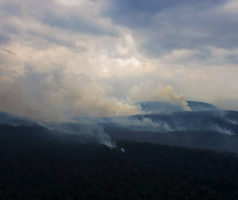 Bushfire smoke above an area near Lake Mackenzie. Thousands of hectares were damaged in the Tasmanian wilderness last summer. 