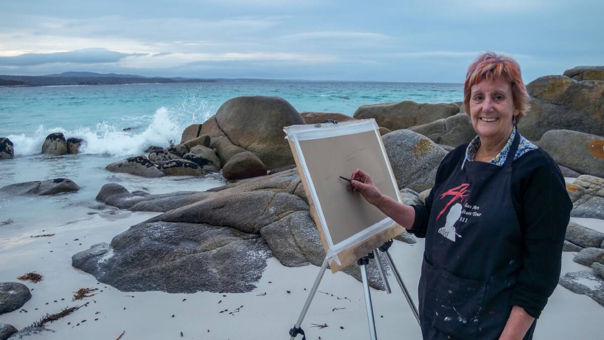 MAKING A SPLASH: Artist Helen Munro sets up to work on the beach at Binalong Bay. She will host an open studio during the Bay of Fires Winter Arts Festival. Pictures: Doug Dingwall.