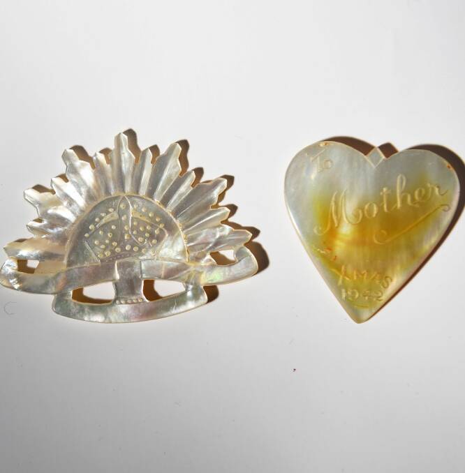 Two of the carvings Pte Wise made from mother-of-pearl during World War II.