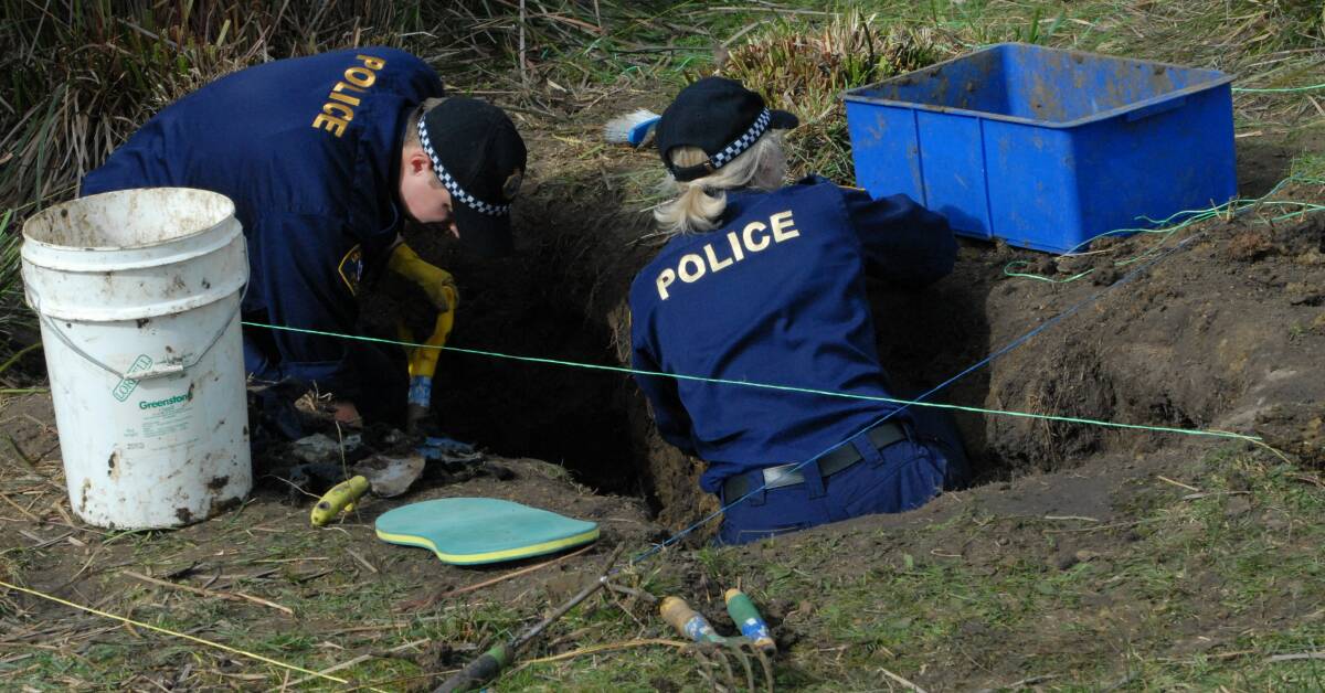 REMAINS: Northern officers Senior Constable Donna Stafford and Constable Hamish Woodgate take part in the practical aspect of the skeletal remains recovery training workshop on a secret property on Thursday. Picture: Tasmania Police