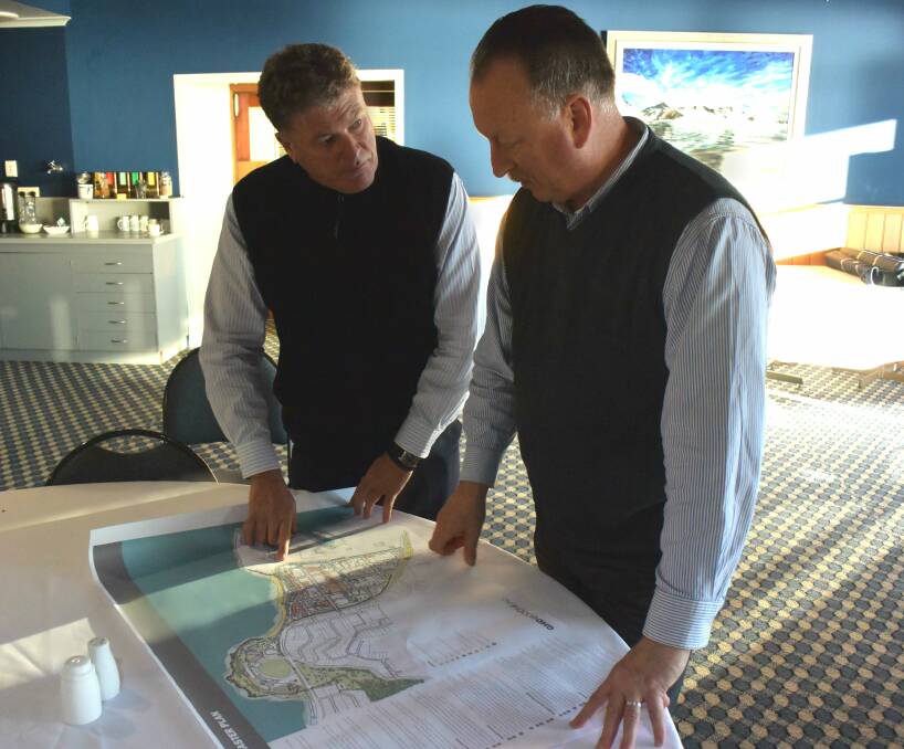 A Glimpse of opportunity: GHD principal planner John Ayers illustrates the proposed areas of development to Burnie Chamber of Commerce and Industry vice president Ian Jones. Picture: Baz Ruddick. 