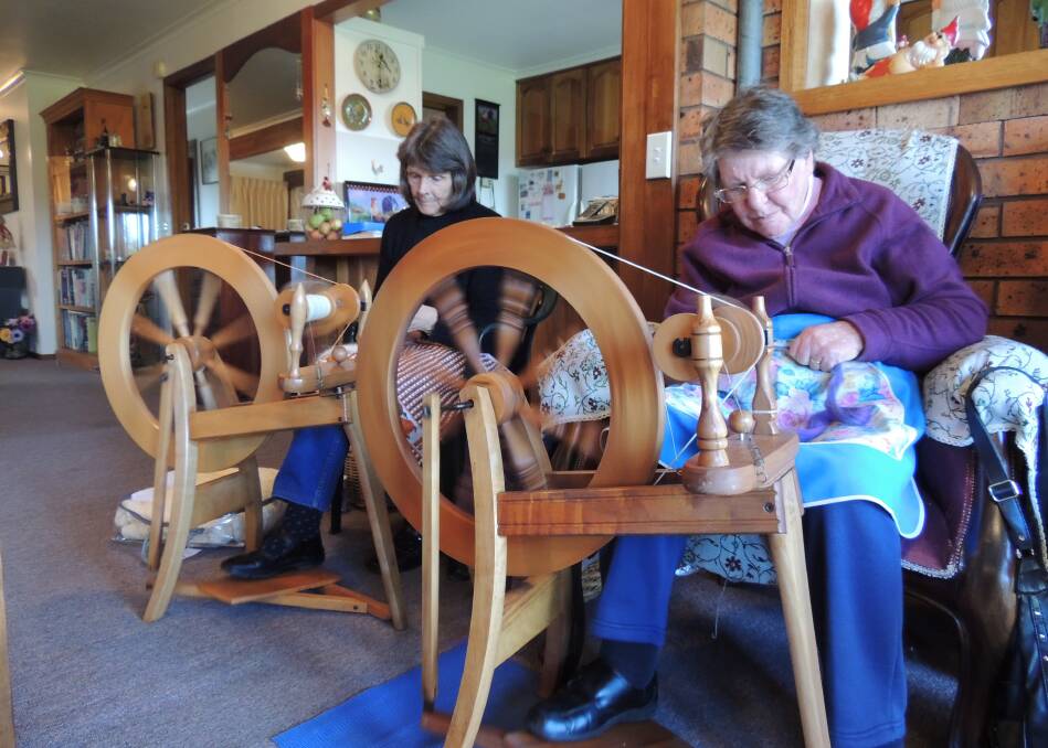 SPINNING: Carol Harris and Eileen Day, both of Sheffield, spinning fleece during a Handweavers, Spinners and Dyers Guild of Tasmania meet-up.