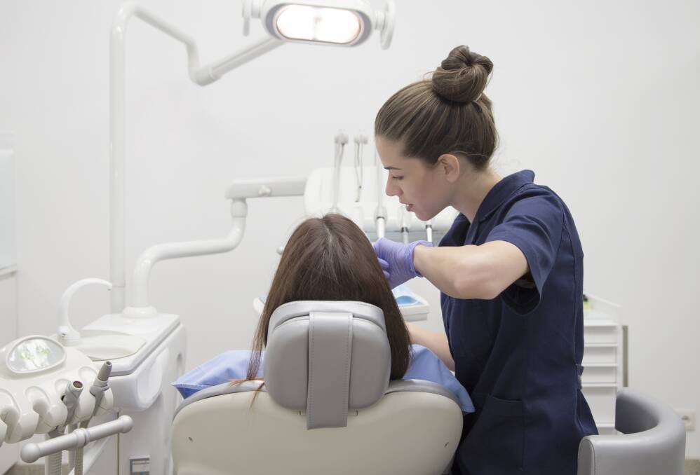 ORAL HEALTH: A photograph of a patient being treated by a dentist. Oral health issues have been linked to a number of chronic illnesses. Picture: Shutterstock/Nikodash