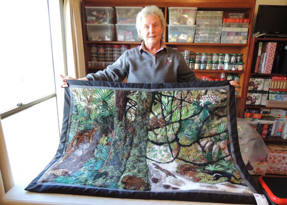 Carole MacDonald was challenged by the group to make a wall hanging, and she created a bush scene.