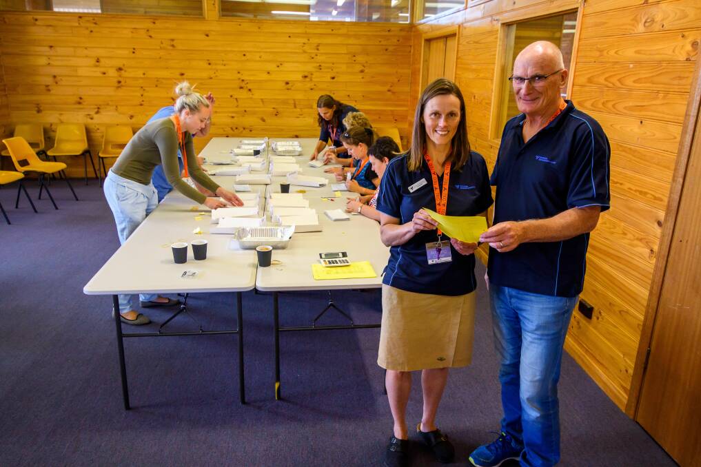 Final countdown: Bass returning officer Jenny van den Bosch and assistant returning officer David Gibbins oversee counting after the state election. Picture: Scott Gelston