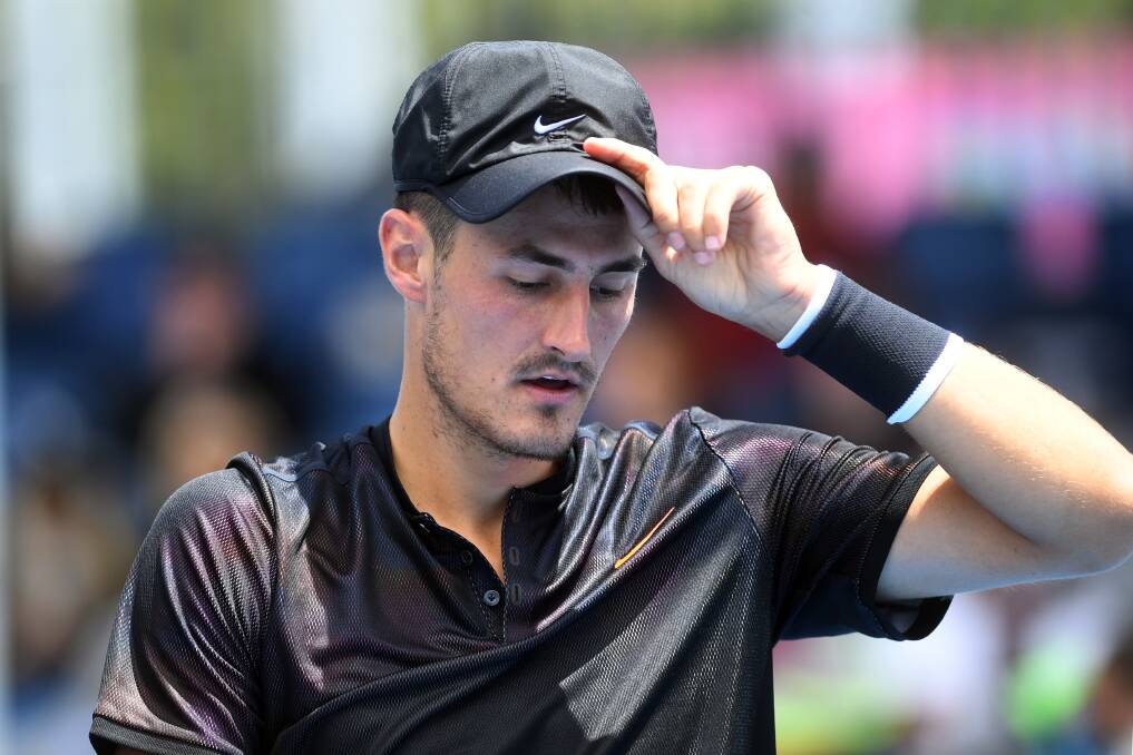 Bernard Tomic reacts against Lorenzo Sonego of Italy during qualifying round 3 for the Australian Open tennis tournament. Picture: AAP
