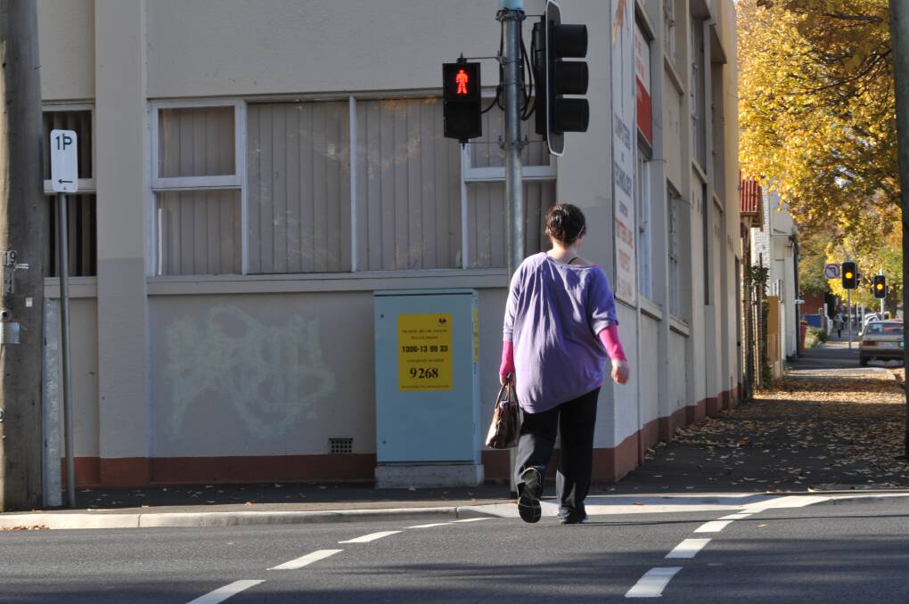A file photo of a pedestrian crossing the street. Sharon Langerak says a campign is needed to improve pedestrian safety.