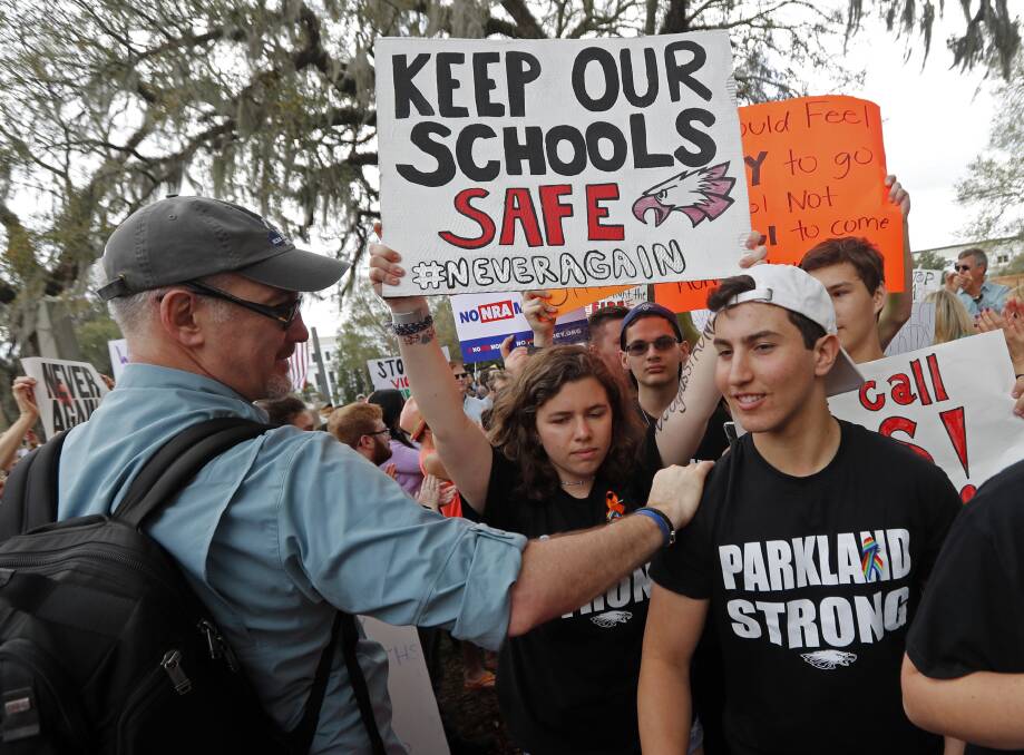 Student survivors from Marjory Stoneman Douglas High School are greeted as they arrive at a rally for gun control reform on the steps of the state capitol, in Tallahassee, Florida. Picture: AP