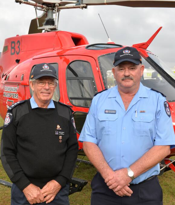 FIREFIGHTERS: David Bonney, of the Gunns Plains brigade, and Rob Deverell, senior station officer for the North-West region, were thanked for their service during a tough firefighting season. Picture: Brodie Weeding