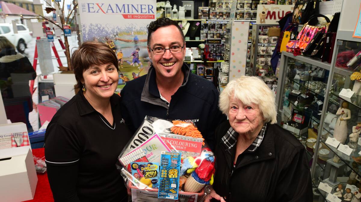 NEWSNOW: newsXpress George Town owner Sue Sherriff, Fairfax newspaper sales representative Darren Simmonds and Nancy Burton. Picture: Paul Scambler