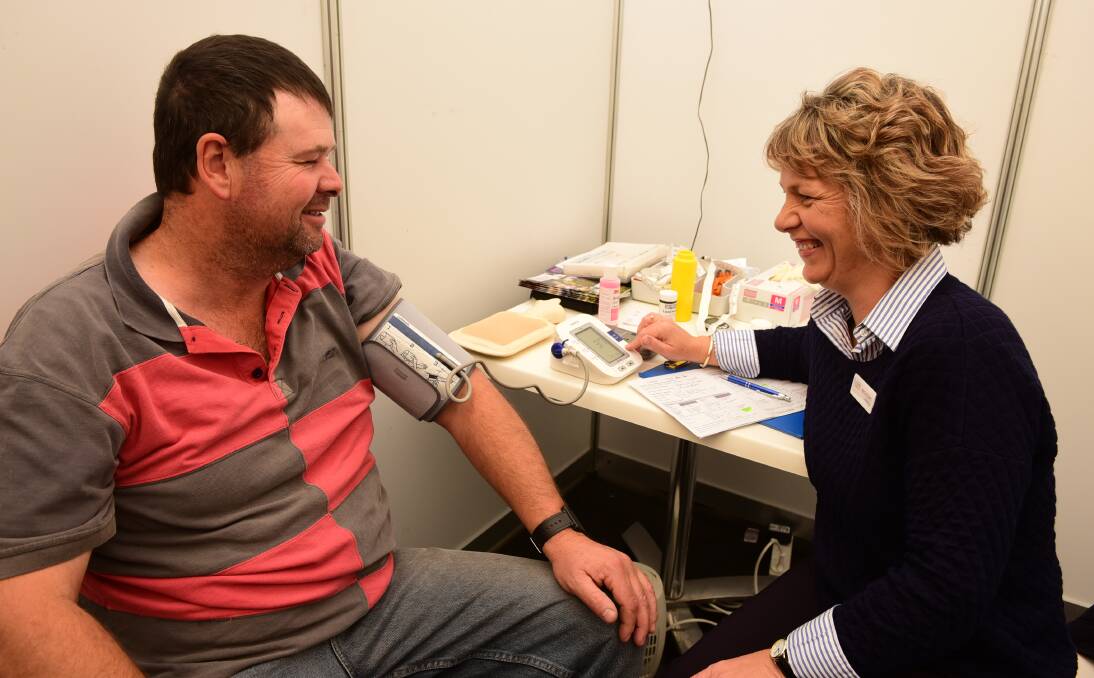 HEALTH CHECK: Justin Burbury, of York Plains, gets his blood pressure checked as part of a free check-up with National Centre for Farmer Health Jeanne Dekker (RN). Picture: Paul Scambler