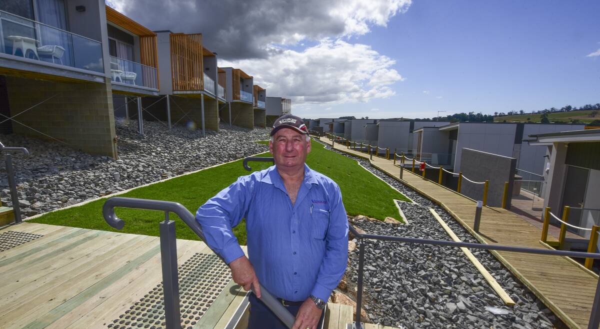 BOARDWALK CONNECTION: Developer and owner Allan Virieux standing at the link between the two rows of new accommodation at the Rosevears Hotel development.
