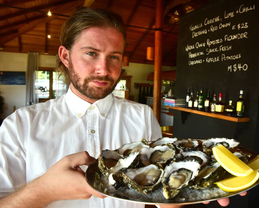 ON THE MENU: Hallams Waterfront owner Salisbury Hallam with some freshly shucked natural oysters. Hallams serve 25 dozen oysters every day to its customers, which has continued despite the POMS virus. Picture: Paul Scambler.