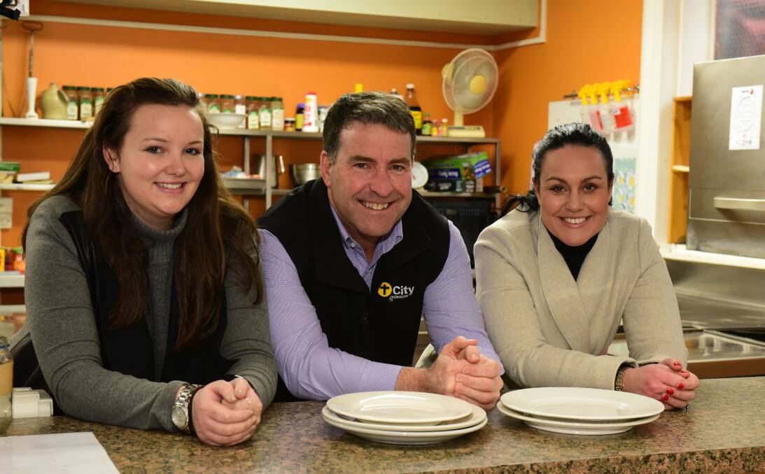 TUCK IN: Cataract on Paterson's Rebecca McDonald, City Mission chief executive Stephen Brown and Cataract on Paterson's Karen Burbury in Morton’s Place. Picture: Paul Scambler