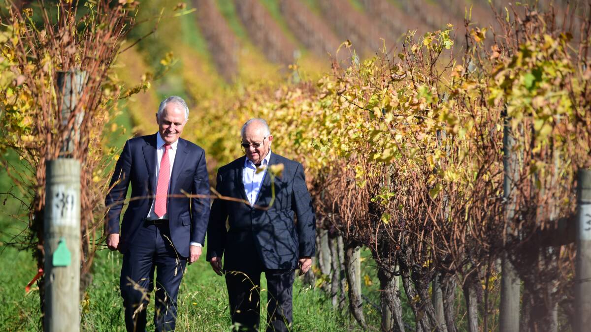 TASMANIA TRIP: Prime Minister Turnbull spruiks the benefits of Free Trade Agreements while being taken on a tour of the winery by Josef Chromy. Picture: Paul Scambler