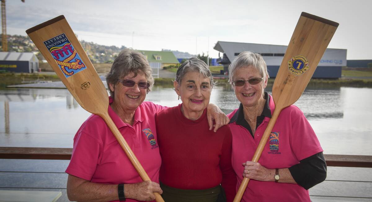 PADDLES UP: Dragon Abreast Northern Tasmania's Beth Sowther, Merran Thurley and Ros Lewis are keenly awaiting Saturday's event. Picture: Paul Scambler.