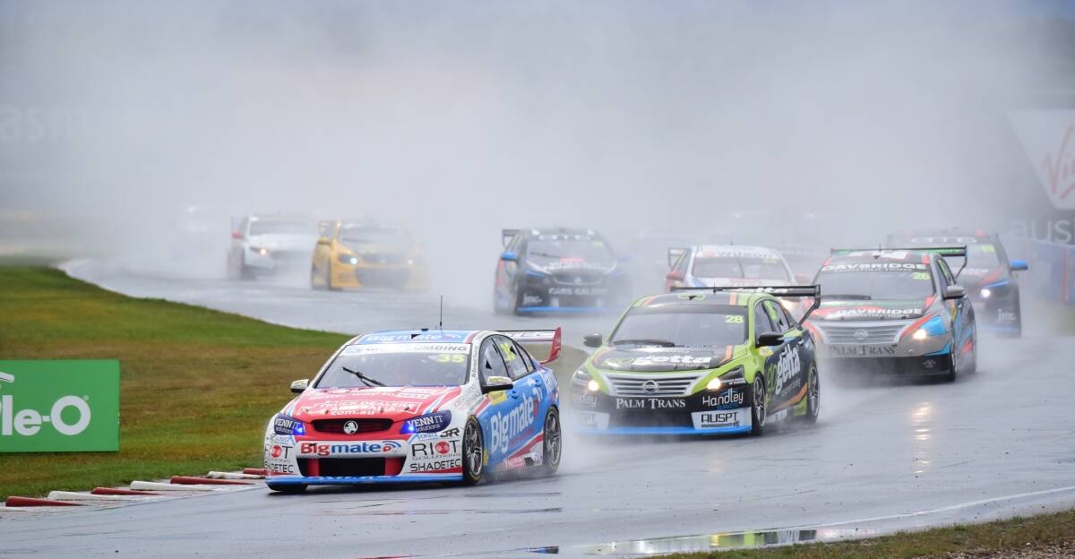 WET: The Super2 series cars negotiate the wet track conditions with Todd Hazelwood leading the field in his Holden Commodore VY. Pictures: Paul Scambler