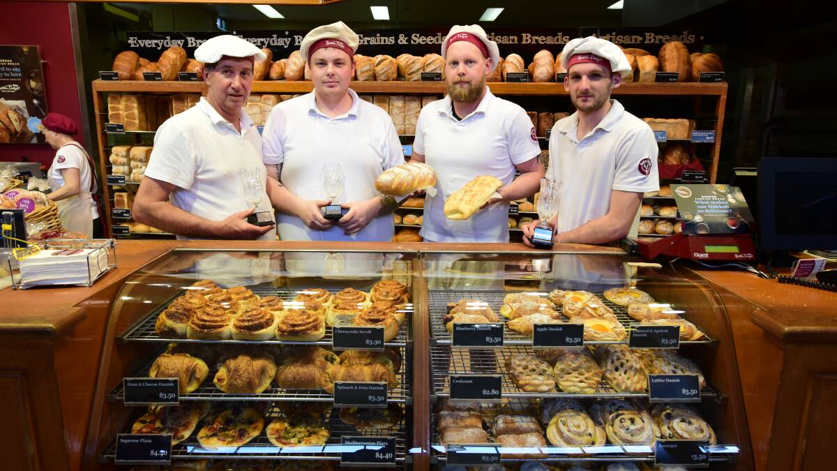 ON A ROLL: Members of the Baker's Delight Mowbray team with their trophies are production manager Darrell Whyte, apprentice Michael Phillips, apprentice Brad Comins and manager Allan Gill. Picture: PAUL SCAMBLER.