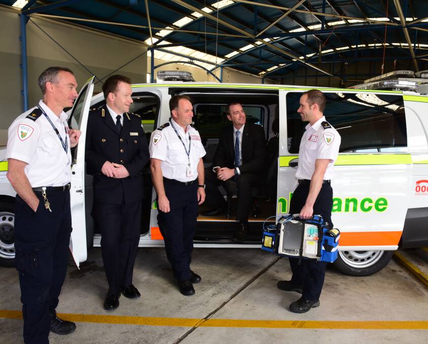 NEW WHEELS: Paramedic Dion Mitchell, Statewide Services manager Garry White, paramedic Glenn Aslin, Health Minister Michael Ferguson, and paramedic Anthony Carnicelli with the new vehicle. Picture: PAUL SCAMBLER