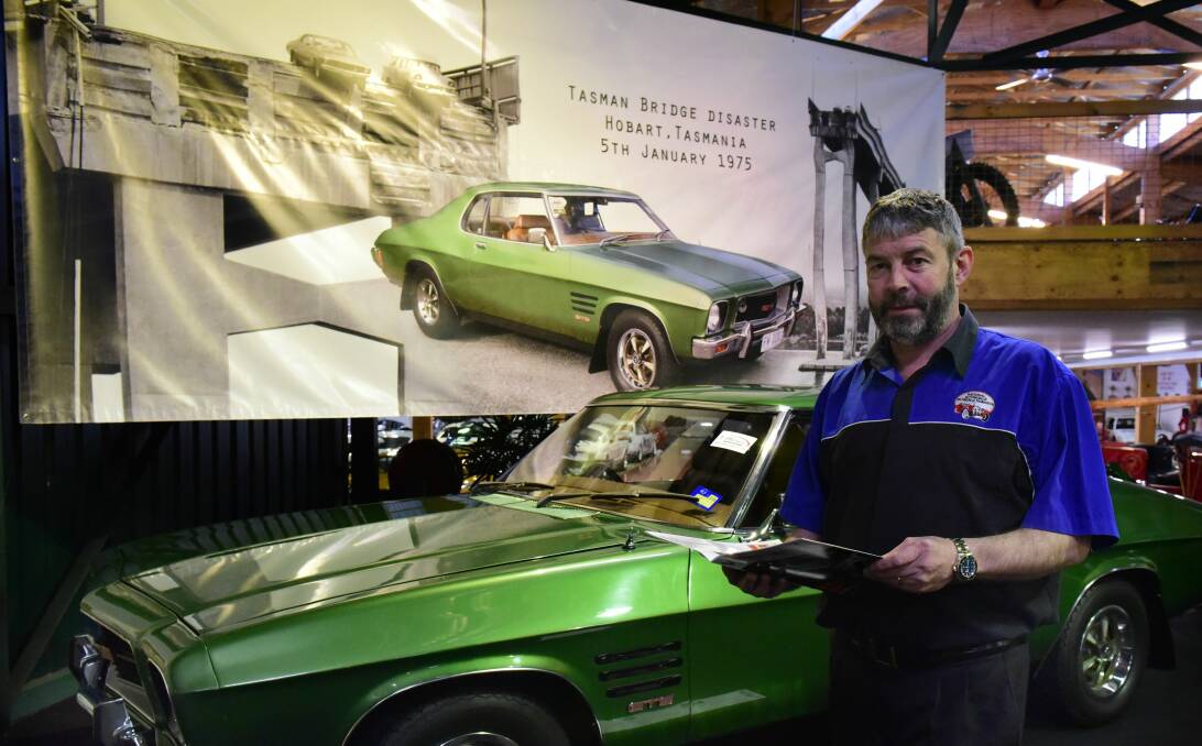 BIRTHDAY: The national Automobile Museum's Phil Costello with a copy of the 20 Years in the City magazine. Picture: PAUL SCAMBLER.