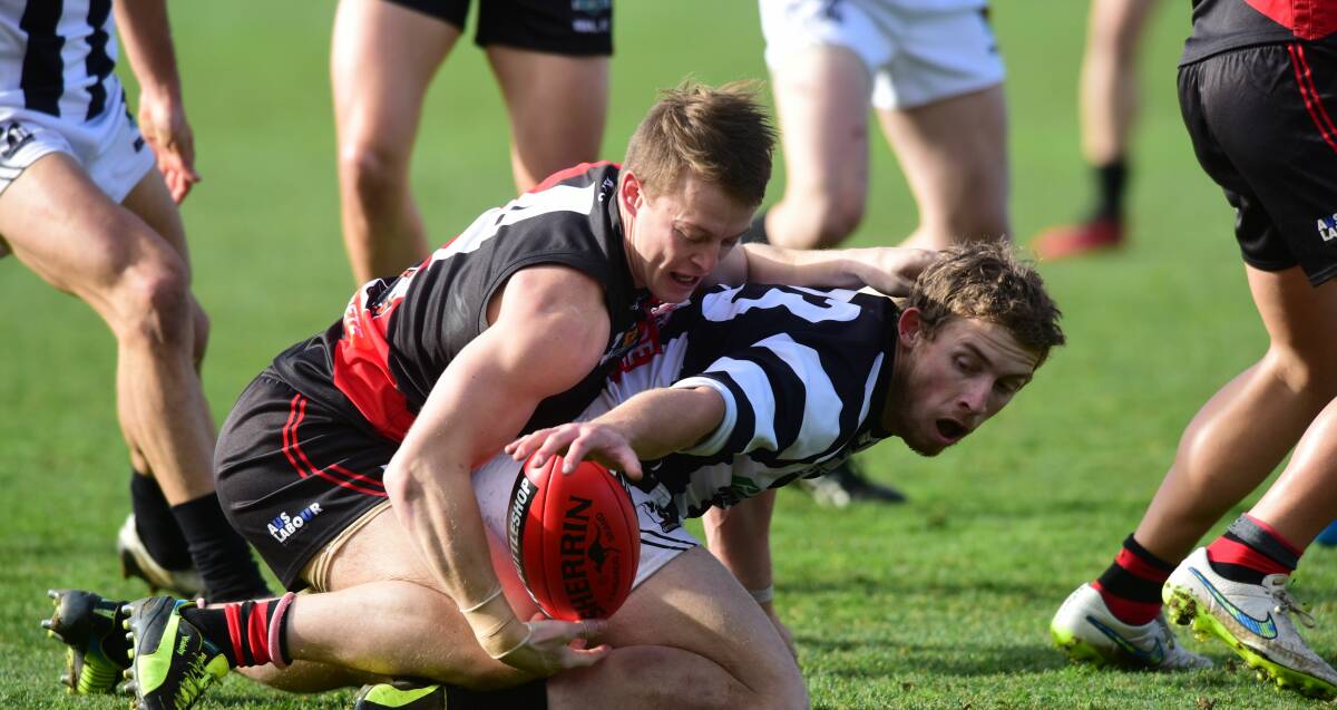 IN THE CLINCHES: North Launceston's Mark Walsh and Glenorchy's Matthew Dilger fight for the ball in their State League clash at Aurora Stadium. Picture: Paul Scambler
