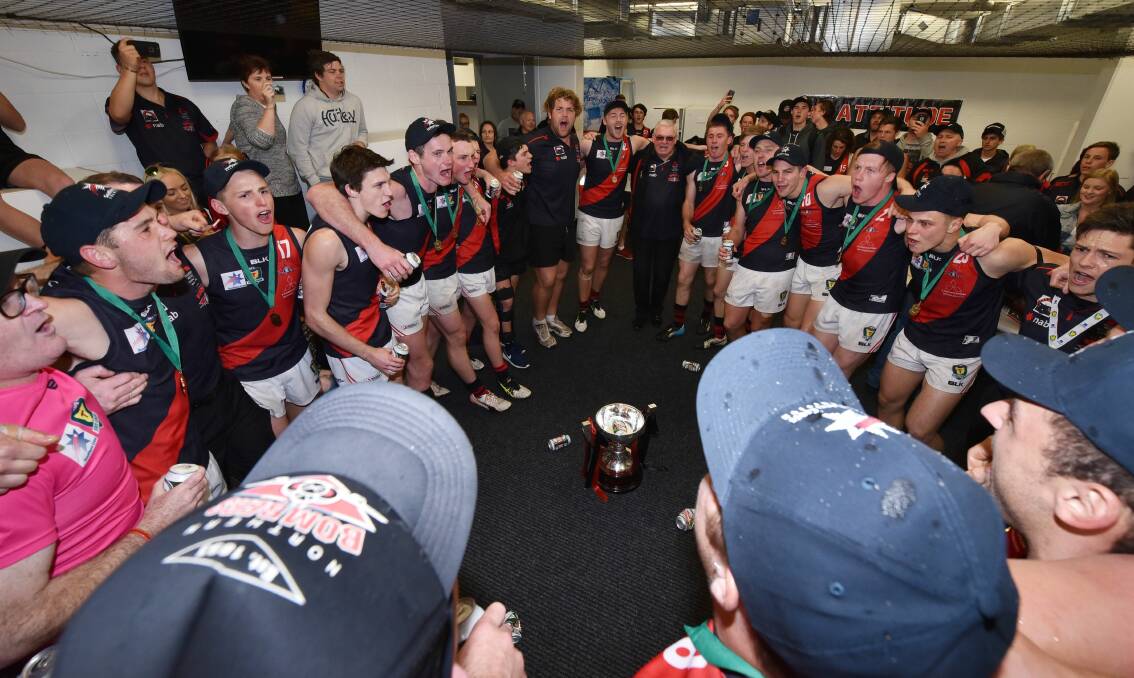 MEMORIES: North Launceston players and supporters sing the club song after last year's grand final victory over Glenorchy. Picture: Scott Gelston