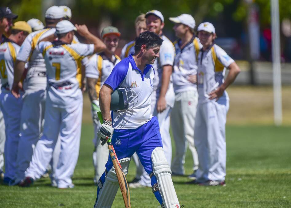 OUT: Beauty Point players celebrate the wicket of ACL batsman Shaun Woods in their semi-final clash at University Oval. Pictures: Paul Scambler