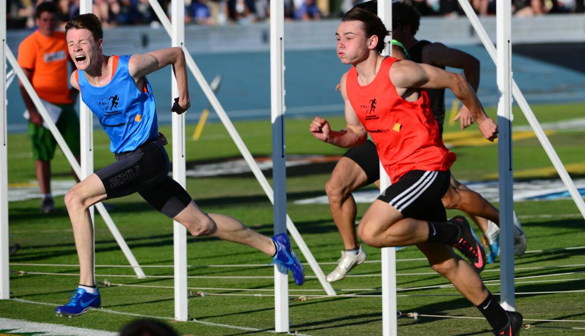 STREETS AHEAD: Victorian Luke Stevens (blue) and Tasmanian Jack Hale (red) in the finish of the Invitation 120-metre sprint at the 2015 Burnie Carnival. The Carnival has always been ahead of the sporting pack in many ways.