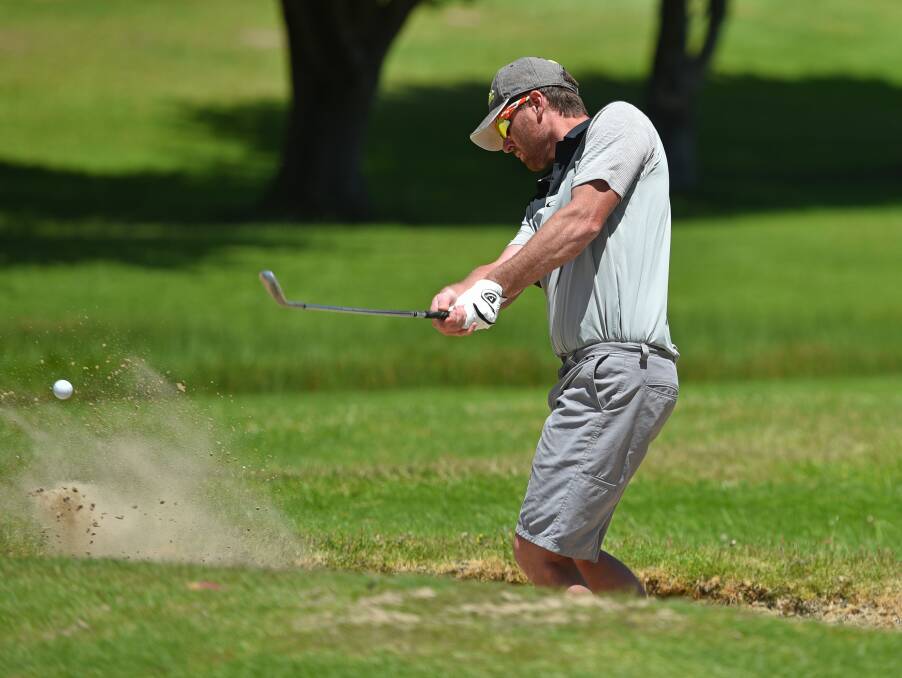Prospect Vale golfer Tim Horton digs one out of the bunker.