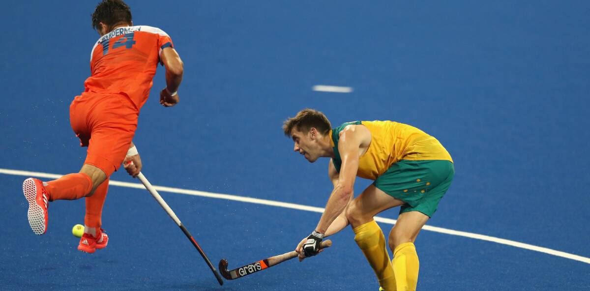 CONTEST: Australia's Eddie Ockenden and Netherland's Robbert Kemperman compete for the ball. Picture: Getty Images