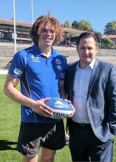 ON AND OFF FIELD: Ben Brown and Tasmanian Football Council manager Jackson Hills in Hobart on Tuesday. Picture: AFL Tasmania