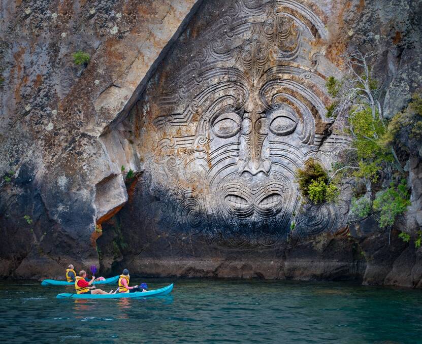 Relax: Kayaking in Great Lake Taupo with Maori rock carvings is the iconic tourist attraction place in Lake Taupo, New Zealand.