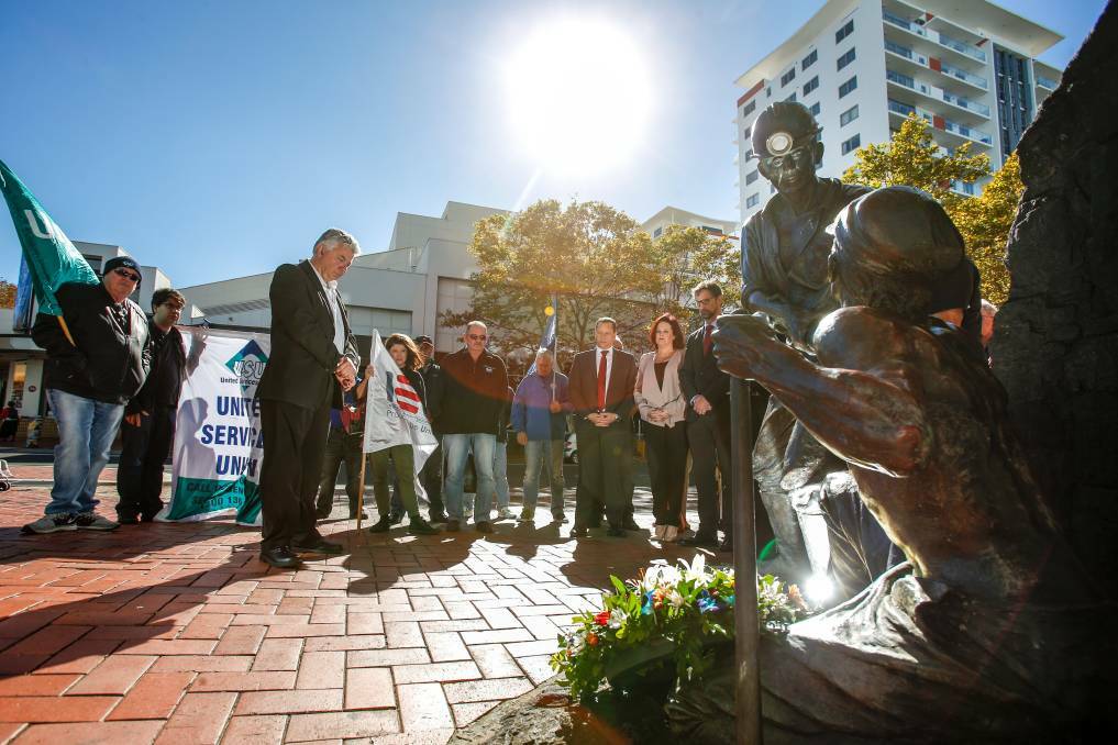 South Coast Labour Council secretary Arthur Rorris bows his head as he remembers workers killed at the job. A ceremony was held at the Wollongong miners' memorial on Burelli Street as part of International Workers' Day commemorations on Friday. Picture: Adam McLean