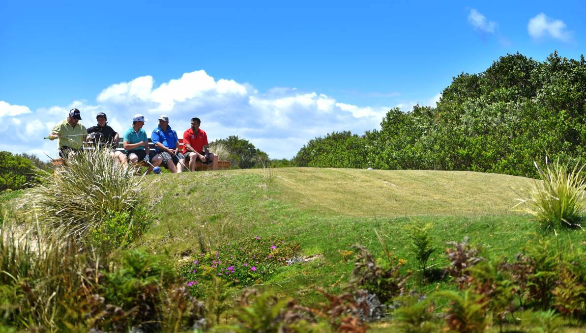 Golfers stop for a break between holes at the Greens Beach golf course. Pictures: Scott Gelston