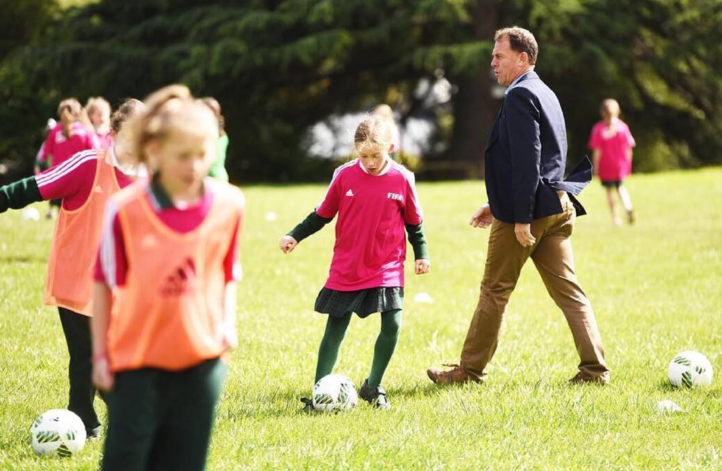 Matildas coach Alen Stajcic looks at the skills of players at East Launceston Primary. Picture: Scott Gelston