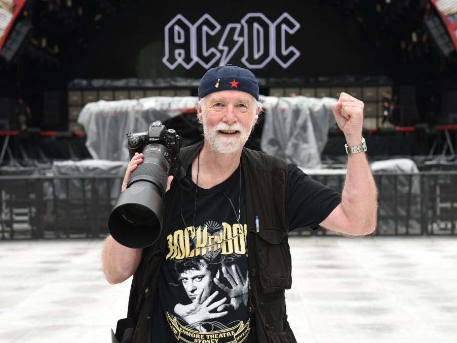 Photographer Bob King with his trusty Nikon camera on the job at AC/DC's Rock or Bust tour. 