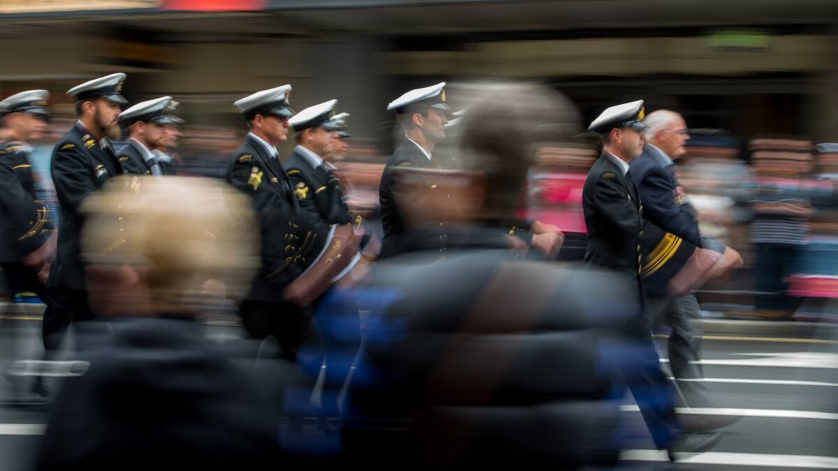 Navy personnel march down Charles Street for the 10.30am Anzac day march in Launceston. Often press photographers are in front of the crowd capturing the event's main personalities, but sometimes the crowd is just as important as the participants. Picture: Scott Gelston. 