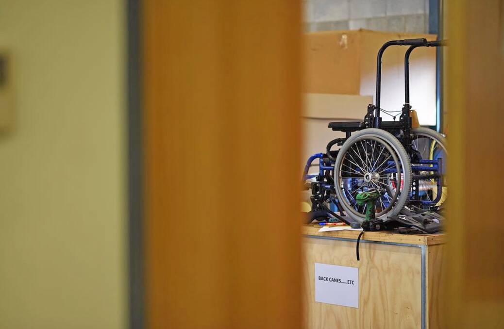 A wheelchair awaiting modification in the workshop at St Giles. Picture: Scott Gelston