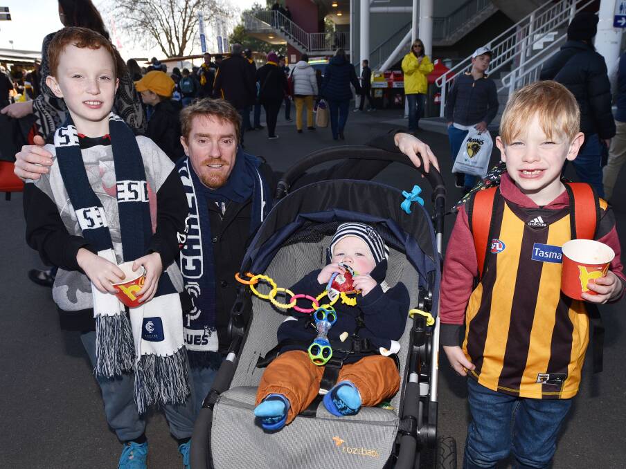 James, 9, and Paul Cragie, Fletcher Rooney, 9 months, and Peter Cragie, 7, of Melbourne.