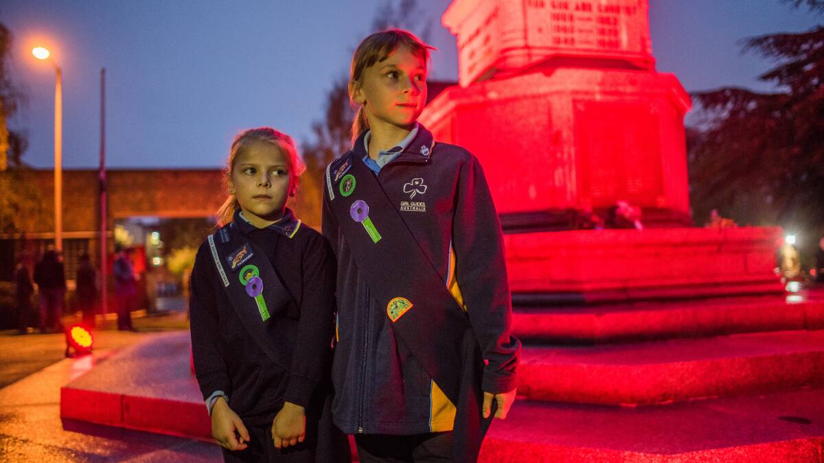 GUIDED: Hadspen Girl Guides Briony, 6, and Taylah Richards, 9, at the Launceston cenotaph after the 2017 Anzac Day dawn service. Picture: Scott Gelston