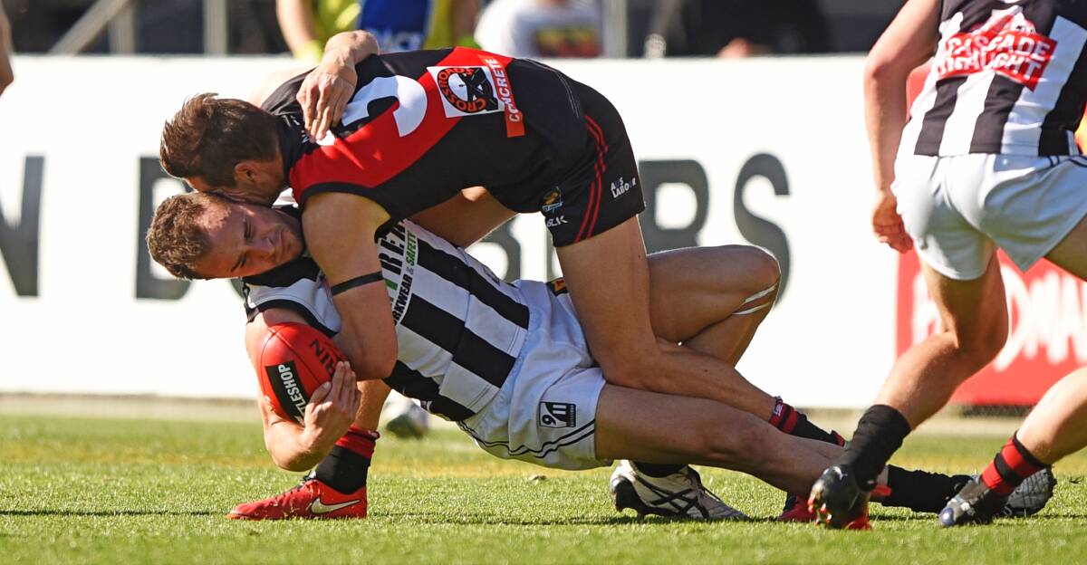 ELITE: North captain Taylor Whitford tackles Glenorchy's Jaye Bowden to the ground in the second term.