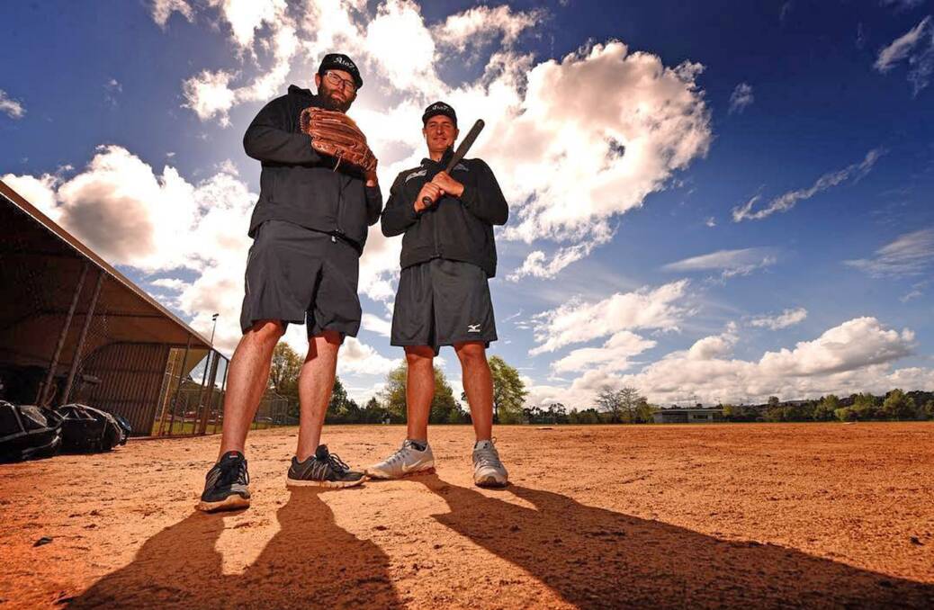 Australian softball representatives Adam Folkard and Zenon Winters check out the diamond at Churchill Park. Photo: Scott Gelston
