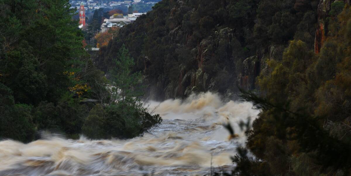 RAGING RIVER: The South Esk River continued to thunder towards Launceston mid-afternoon on Wednesday. Picture: Scott Gelston
